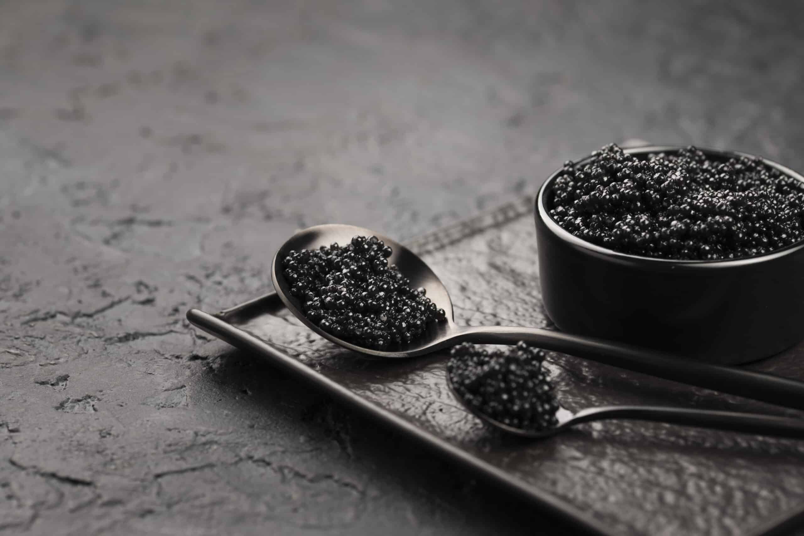 black-caviar-bowl-with-spoons-ladle